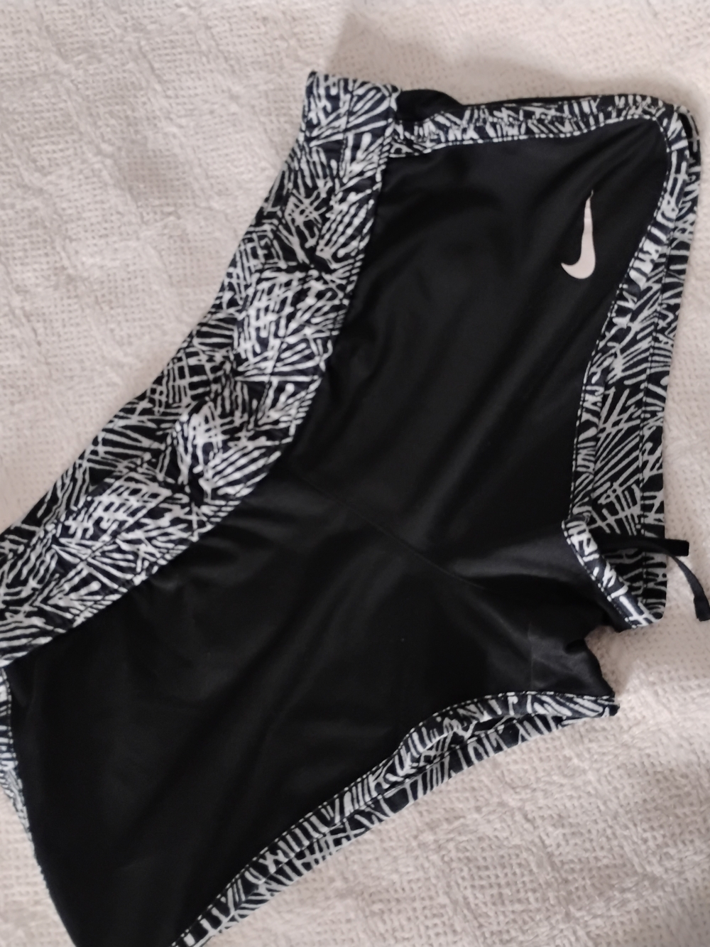 Nike Black Athletic Shorts with Black-and-White Pattern Trim